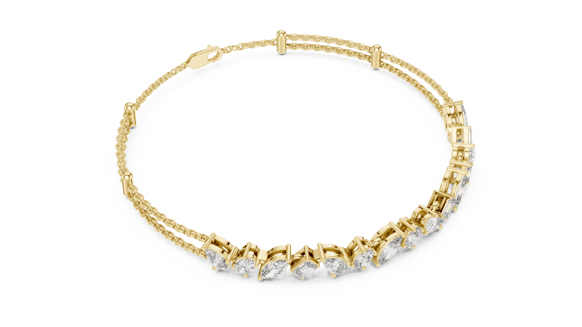 Marquise and emerald diamond tennis bracelet featuring mixed-cut sparkling stones in an elegant chain design by Orova Jewels.