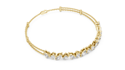 Marquise and emerald diamond tennis bracelet featuring mixed-cut sparkling stones in an elegant chain design by Orova Jewels.