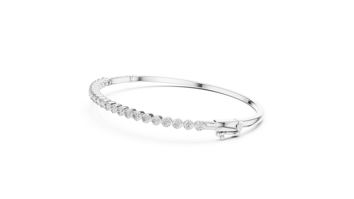 Classic round diamond hinged bangle featuring brilliant round-cut diamonds set along a polished white gold bracelet with a secure clasp by Orova Jewels.