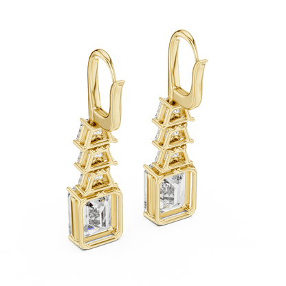 Elegant emerald cut diamond drop earrings featuring a geometric drop design with sparkling emerald-cut stones by Orova Jewels.