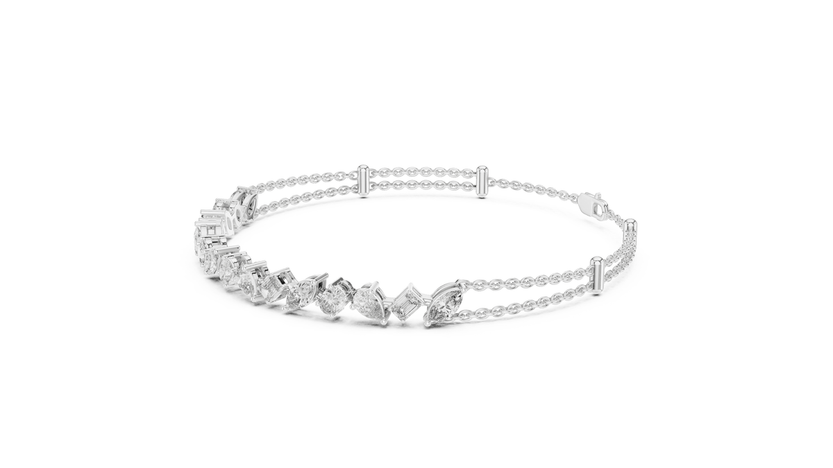 Marquise and emerald diamond tennis bracelet featuring mixed-cut sparkling stones in an elegant chain design by Orova Jewels.