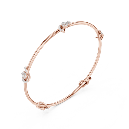 Minimalist floral crystal bangle bracelet featuring delicate flower-inspired charms on a sleek polished silver-tone bangle by Orova Jewels.