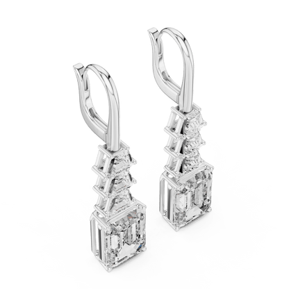 Elegant emerald cut diamond drop earrings featuring a geometric drop design with sparkling emerald-cut stones by Orova Jewels.