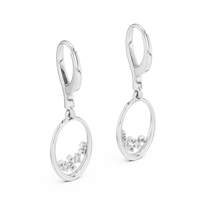 Oval diamond drop hoop earrings featuring an open oval frame with sparkling round and baguette-cut stone accents by Orova Jewels.