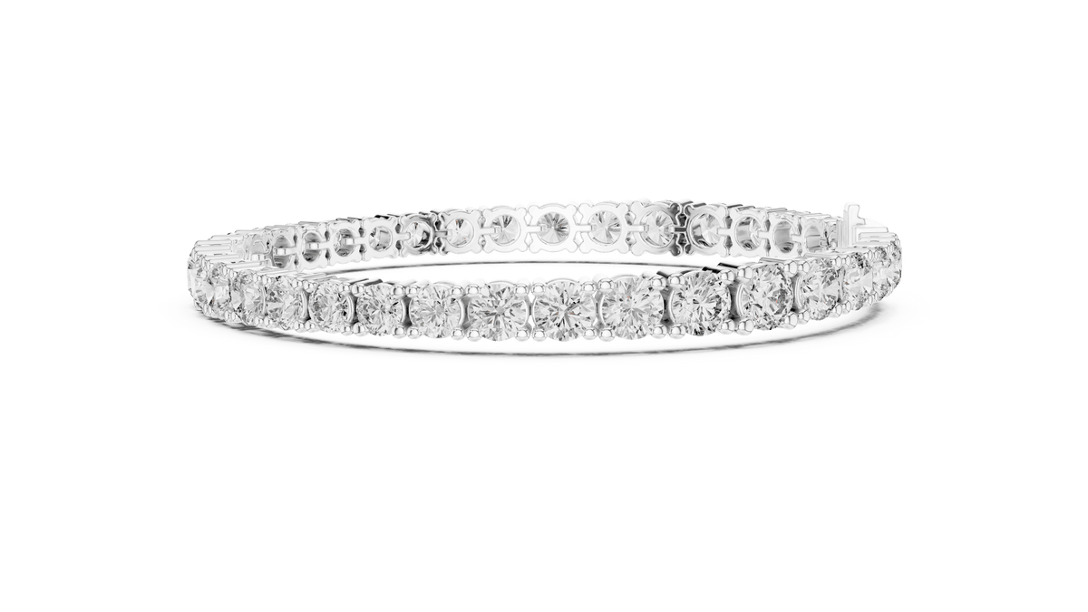 Round Brilliant Diamond Tennis Bracelet featuring a continuous row of sparkling round-cut diamonds in a classic four-prong setting with a secure box clasp by Orova Jewels.
