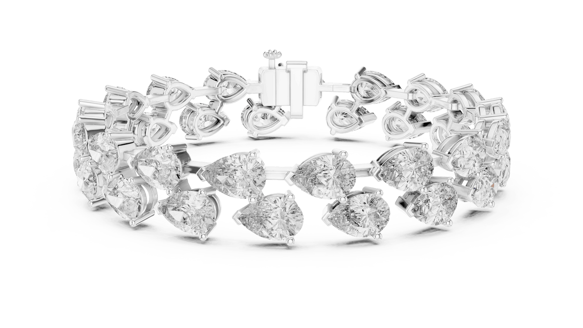 Pear Cut Diamond Tennis Bracelet featuring a double row of sparkling pear-shaped stones with a secure box clasp by Orova Jewels.