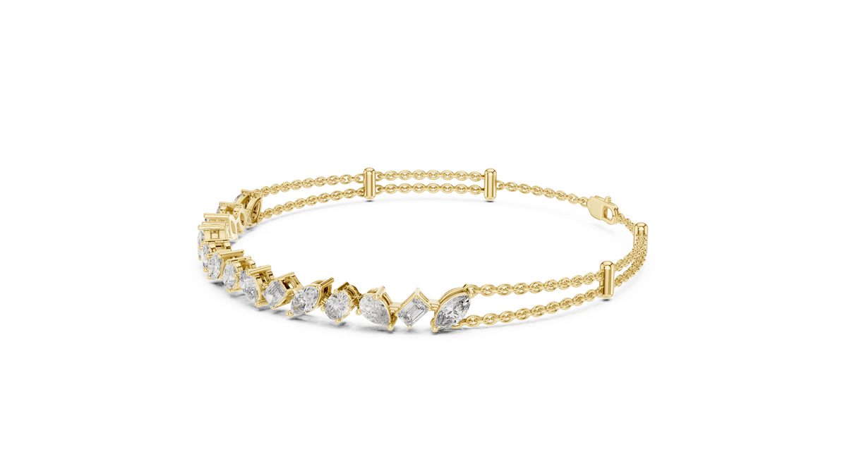 Marquise and emerald diamond tennis bracelet featuring mixed-cut sparkling stones in an elegant chain design by Orova Jewels.