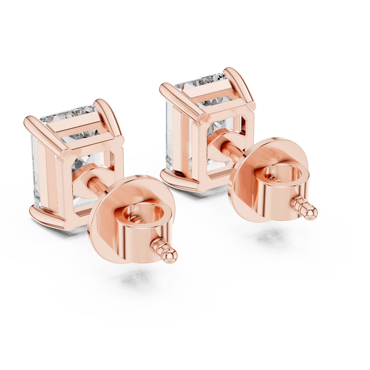 Emerald cut solitaire diamond stud earrings featuring rectangular-cut stones in a classic four-prong setting with secure screw-back closure by Orova Jewels.