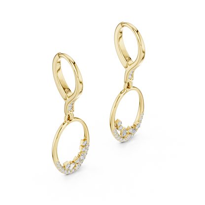 Oval diamond drop hoop earrings featuring an open oval frame with sparkling round and baguette-cut stone accents by Orova Jewels.