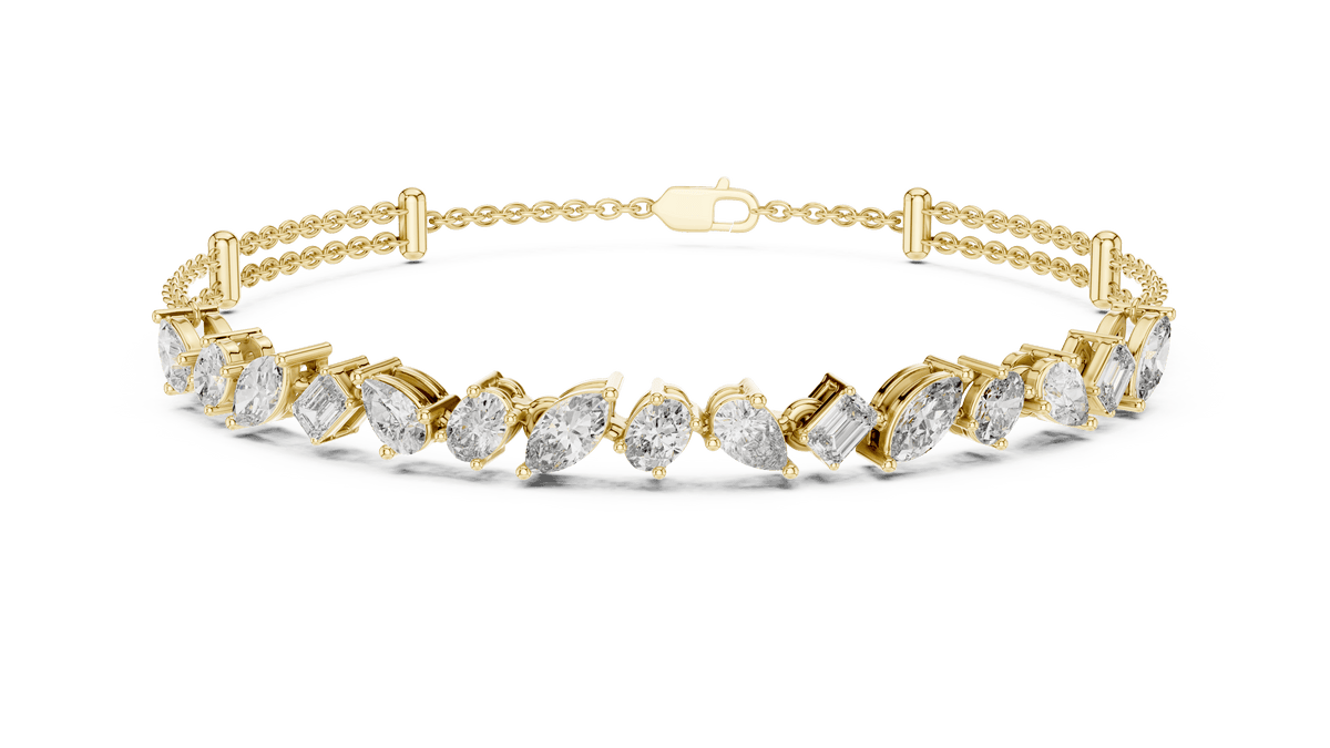 Marquise and emerald diamond tennis bracelet featuring mixed-cut sparkling stones in an elegant chain design by Orova Jewels.