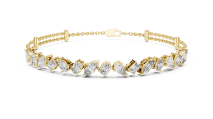 Marquise and emerald diamond tennis bracelet featuring mixed-cut sparkling stones in an elegant chain design by Orova Jewels.