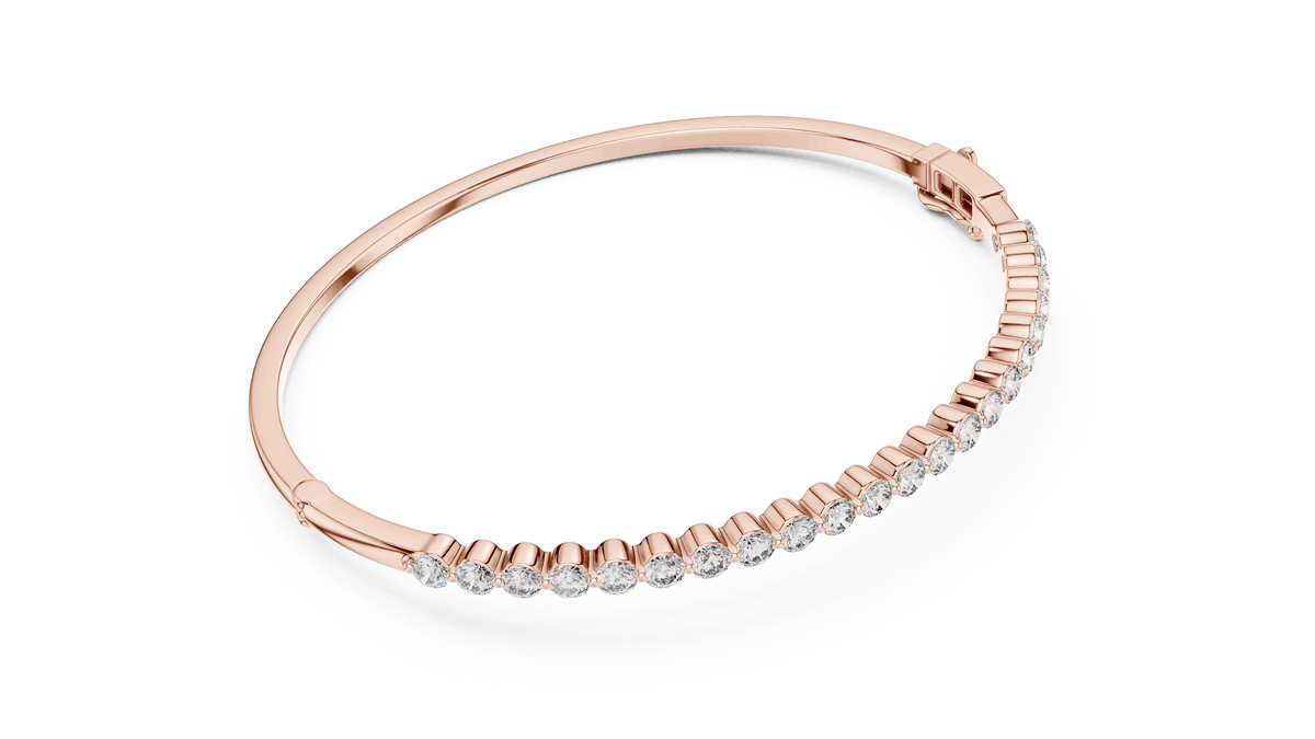Classic round diamond hinged bangle featuring brilliant round-cut diamonds set along a polished white gold bracelet with a secure clasp by Orova Jewels.