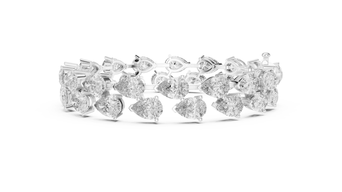 Pear Cut Diamond Tennis Bracelet featuring a double row of sparkling pear-shaped stones with a secure box clasp by Orova Jewels.