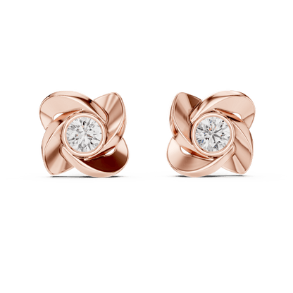 Twisted ribbon diamond stud earrings featuring a brilliant round center stone with a modern swirl design by Orova Jewels.