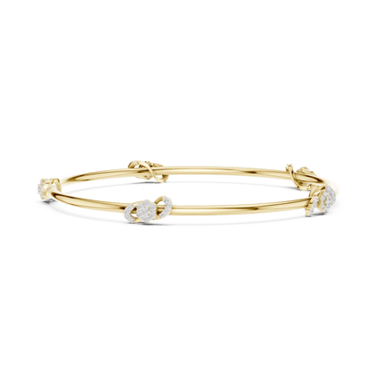 Minimalist floral crystal bangle bracelet featuring delicate flower-inspired charms on a sleek polished silver-tone bangle by Orova Jewels.