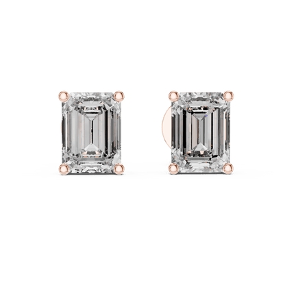 Emerald cut solitaire diamond stud earrings featuring rectangular-cut stones in a classic four-prong setting with secure screw-back closure by Orova Jewels.