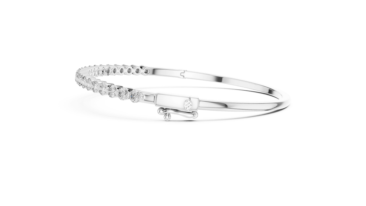 Classic round diamond hinged bangle featuring brilliant round-cut diamonds set along a polished white gold bracelet with a secure clasp by Orova Jewels.