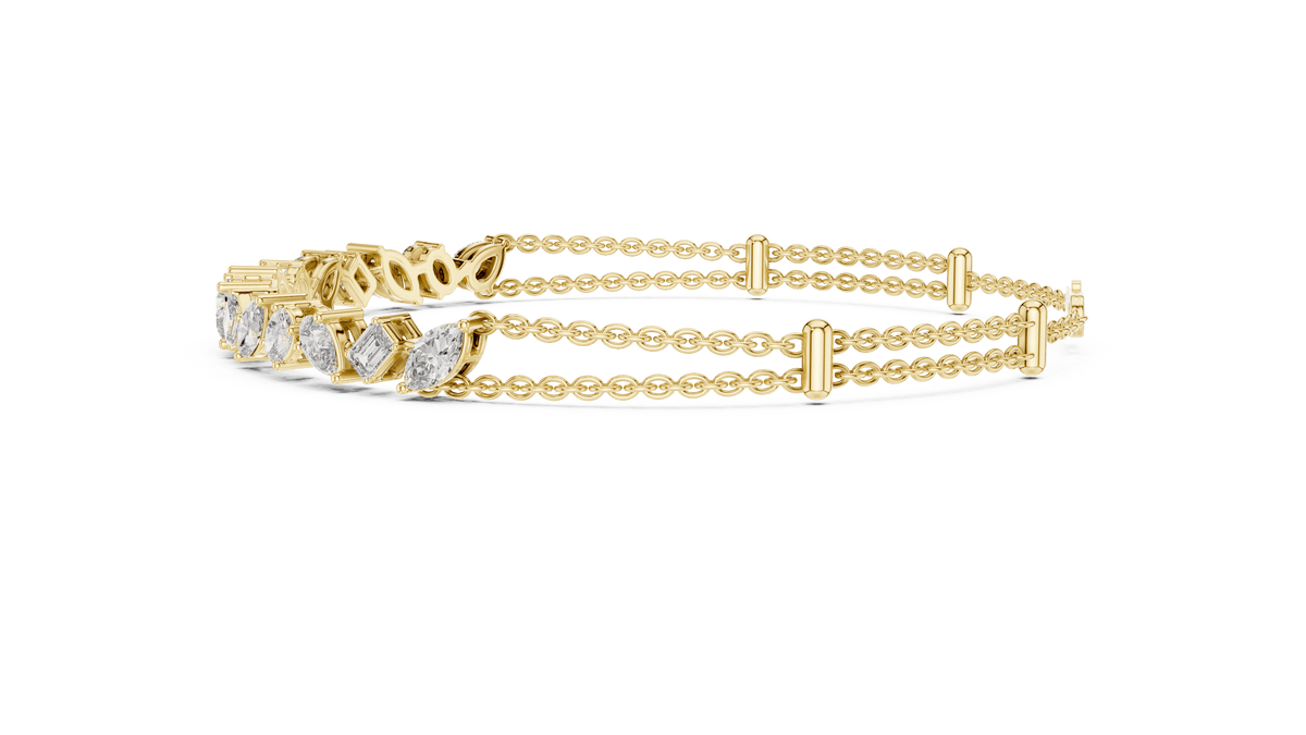 Marquise and emerald diamond tennis bracelet featuring mixed-cut sparkling stones in an elegant chain design by Orova Jewels.