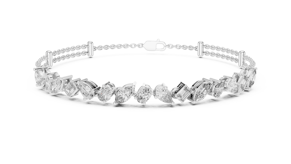 Marquise and emerald diamond tennis bracelet featuring mixed-cut sparkling stones in an elegant chain design by Orova Jewels.