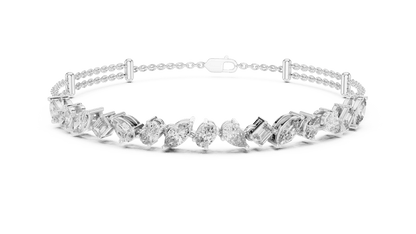 Marquise and emerald diamond tennis bracelet featuring mixed-cut sparkling stones in an elegant chain design by Orova Jewels.