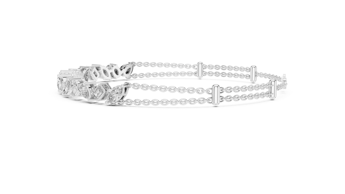 Marquise and emerald diamond tennis bracelet featuring mixed-cut sparkling stones in an elegant chain design by Orova Jewels.