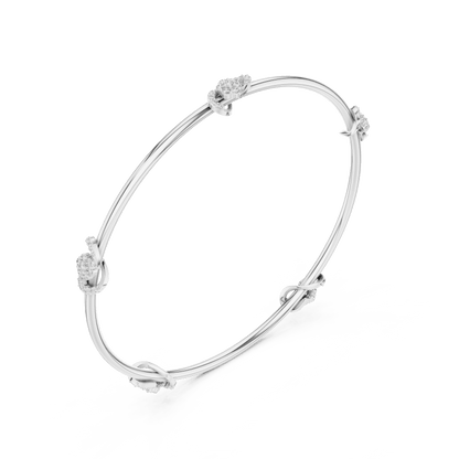 Minimalist floral crystal bangle bracelet featuring delicate flower-inspired charms on a sleek polished silver-tone bangle by Orova Jewels.