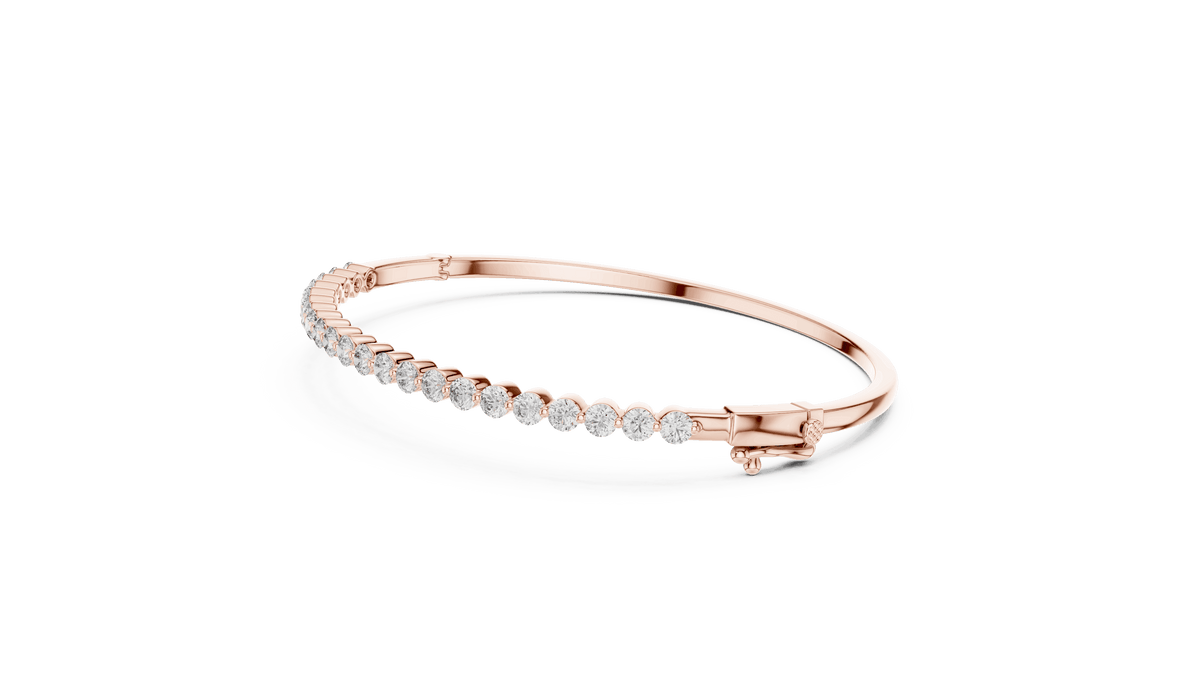 Classic round diamond hinged bangle featuring brilliant round-cut diamonds set along a polished white gold bracelet with a secure clasp by Orova Jewels.