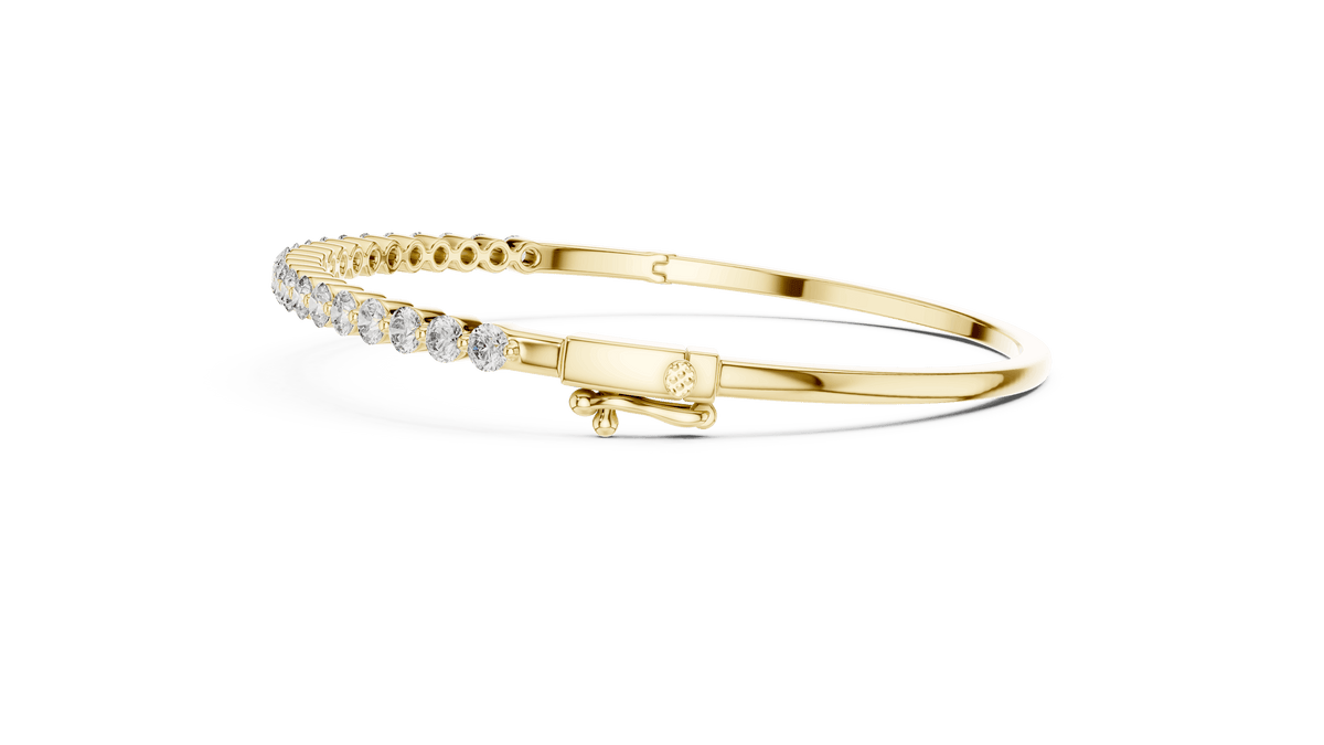 Classic round diamond hinged bangle featuring brilliant round-cut diamonds set along a polished white gold bracelet with a secure clasp by Orova Jewels.