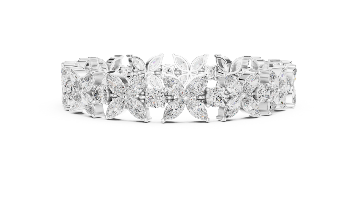 Marquise Floral Diamond Tennis Bracelet featuring sparkling flower motifs crafted with marquise-cut and round brilliant stones in a polished white gold finish by Orova Jewels.