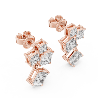 Princess cut diamond cluster drop earrings featuring cascading square-cut stones in a modern geometric design by Orova Jewels.
