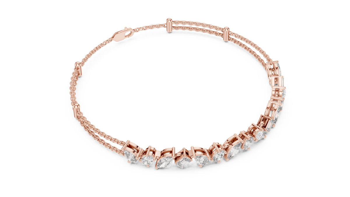 Marquise and emerald diamond tennis bracelet featuring mixed-cut sparkling stones in an elegant chain design by Orova Jewels.