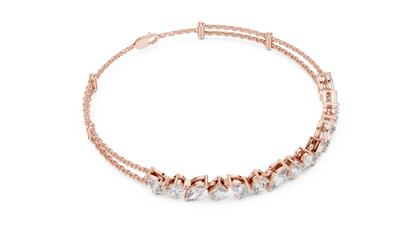 Marquise and emerald diamond tennis bracelet featuring mixed-cut sparkling stones in an elegant chain design by Orova Jewels.