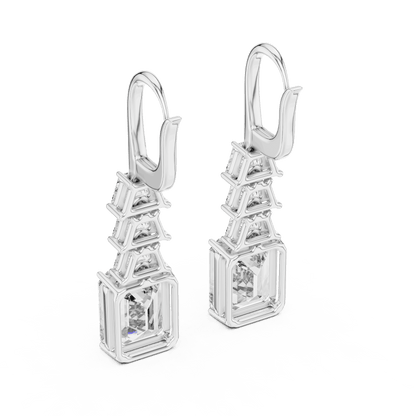 Elegant emerald cut diamond drop earrings featuring a geometric drop design with sparkling emerald-cut stones by Orova Jewels.