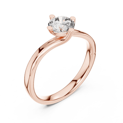 Twisted solitaire diamond engagement ring featuring a round-cut center stone in a four-prong setting with a sleek sculpted twisted band by Orova Jewels.