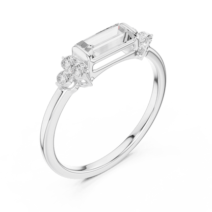 Emerald Cut Diamond Three-Stone Engagement Ring featuring an emerald-cut center stone with round diamond side accents on a polished band by Orova Jewels.