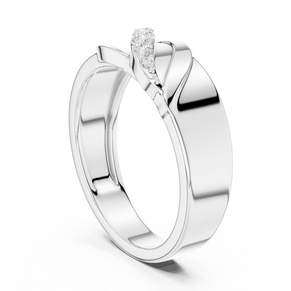 Modern twist solitaire diamond ring featuring a sleek crossover band and sparkling round center stone by Orova Jewels.
