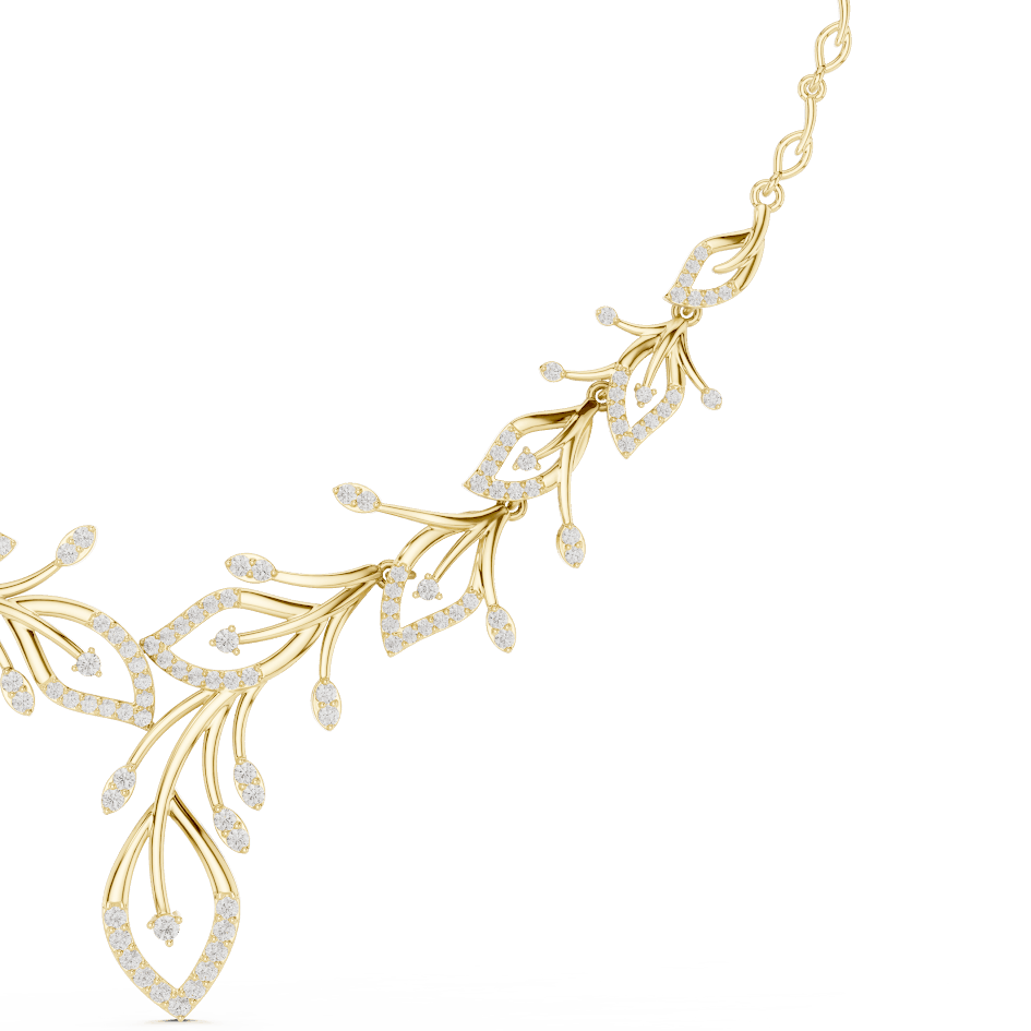 Nature-inspired yellow gold leaf necklace with an elegant vine design and sparkling stone accents by Orova Jewels.