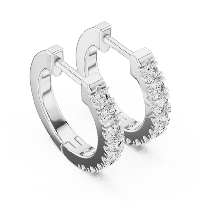 Diamond huggie hoop earrings featuring a row of sparkling round stones with a secure hinged closure by Orova Jewels.