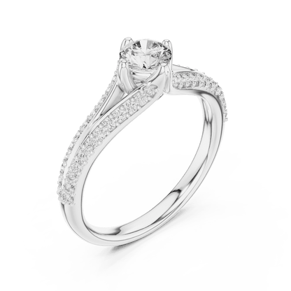 Twisted pavé solitaire diamond ring featuring a round-cut center stone, elegant crossover band, and sparkling pavé-set diamonds by Orova Jewels.