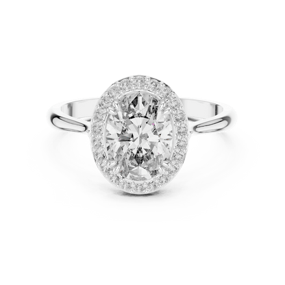 Classic halo diamond engagement ring featuring a brilliant round-cut center stone surrounded by a sparkling halo in a sleek cathedral-style setting by Orova Jewels.