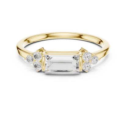 Emerald Cut Diamond Three-Stone Engagement Ring featuring an emerald-cut center stone with round diamond side accents on a polished band by Orova Jewels.