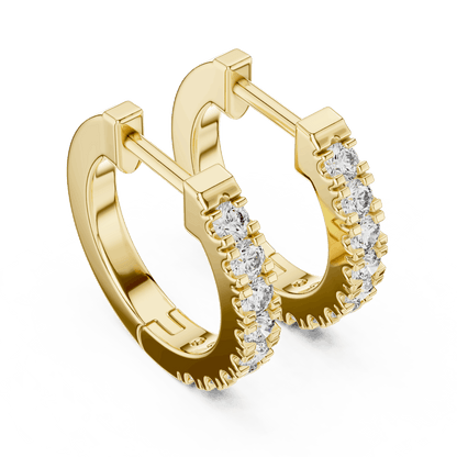 Diamond huggie hoop earrings featuring a row of sparkling round stones with a secure hinged closure by Orova Jewels.