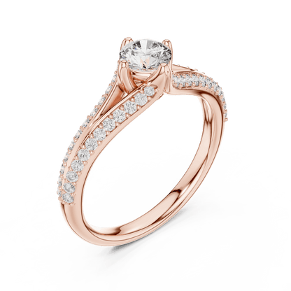 Twisted pavé solitaire diamond ring featuring a round-cut center stone, elegant crossover band, and sparkling pavé-set diamonds by Orova Jewels.
