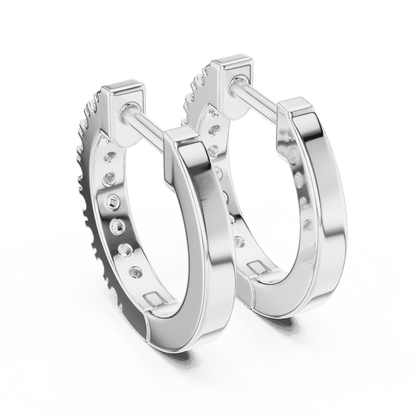Diamond huggie hoop earrings featuring a row of sparkling round stones with a secure hinged closure by Orova Jewels.
