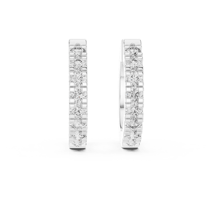Diamond huggie hoop earrings featuring a row of sparkling round stones with a secure hinged closure by Orova Jewels.