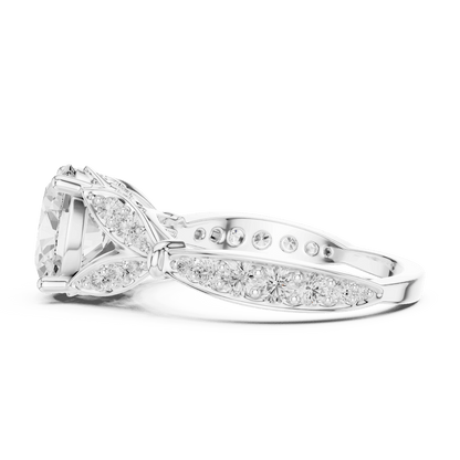 Vintage Leaf Solitaire Diamond Engagement Ring featuring a round brilliant center stone, marquise leaf motifs, and pavé diamond accents on a polished band by Orova Jewels.