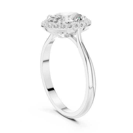 Classic halo diamond engagement ring featuring a brilliant round-cut center stone surrounded by a sparkling halo in a sleek cathedral-style setting by Orova Jewels.