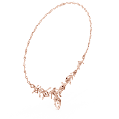 Nature-inspired yellow gold leaf necklace with an elegant vine design and sparkling stone accents by Orova Jewels.