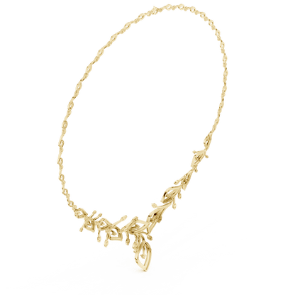 Nature-inspired yellow gold leaf necklace with an elegant vine design and sparkling stone accents by Orova Jewels.