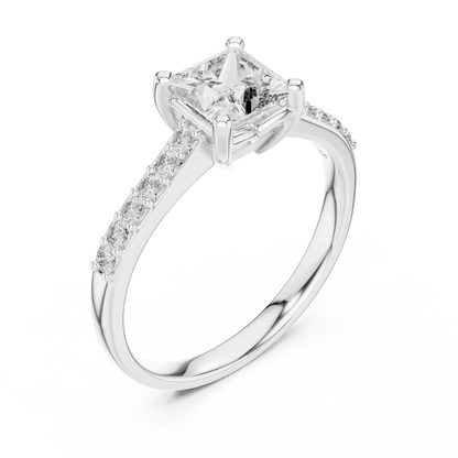 Classic pavé solitaire diamond engagement ring featuring a round-cut center stone in a four-prong setting with a sparkling pavé diamond band by Orova Jewels.